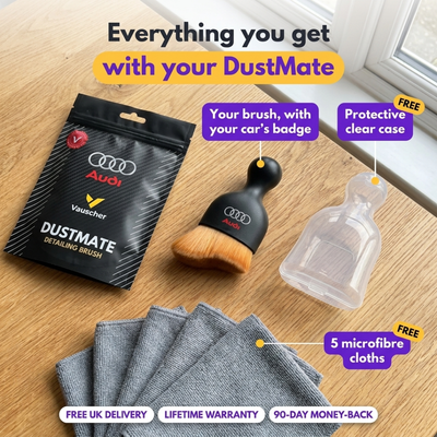 DustMate kit on a table: brush with the Audi logo engraved, black DustMate pouch, clear protective case, 5 microfibre cloths