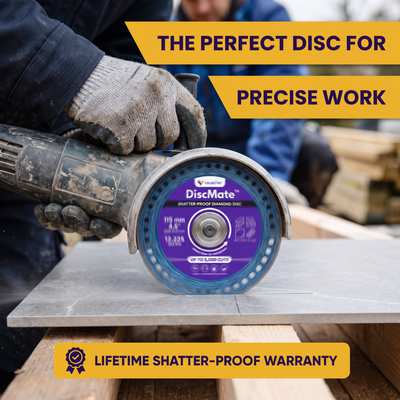 Gloved hands guiding an angle grinder fitted with a DiscMate disc for a precise cut