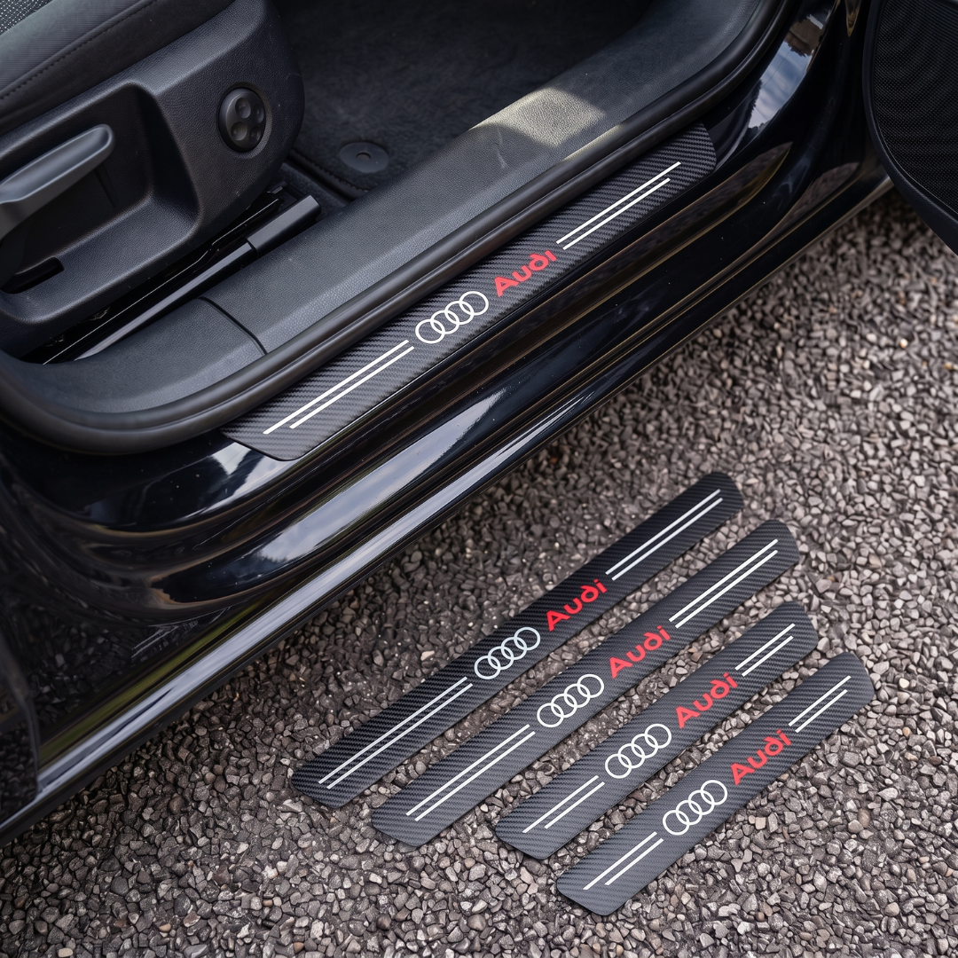 CarbonGrip PRO door sill protectors with Audi logo: one fitted on the sill, set of 4 on the ground