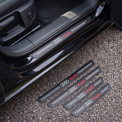 CarbonGrip PRO door sill protectors with Audi logo: one fitted on the sill, set of 4 on the ground