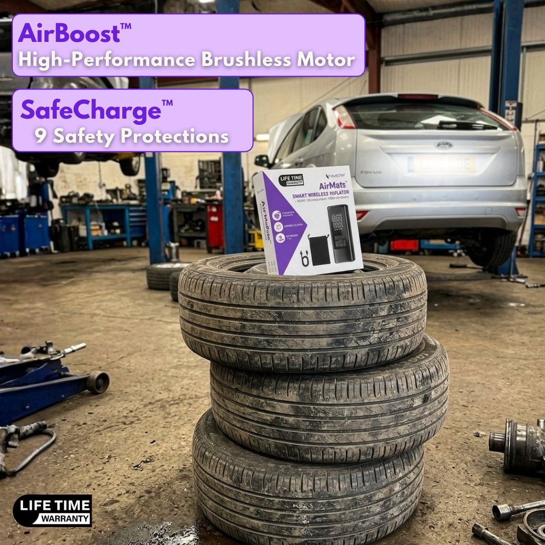 AirMate box on a stack of tyres in a garage, labelled AirBoost brushless motor and SafeCharge 9 safety protections