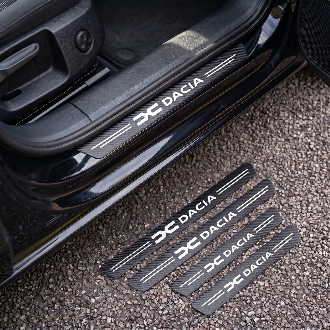 CarbonGrip PRO door sill protectors with new Dacia logo: one fitted on the sill, set of 4 on the ground