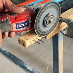 Angle grinder with a DiscMate diamond cutting disc cutting a nailed wooden plank, then a metal strip