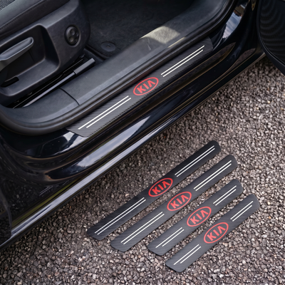 CarbonGrip PRO door sill protectors with classic Kia logo: one fitted on the sill, set of 4 on the ground