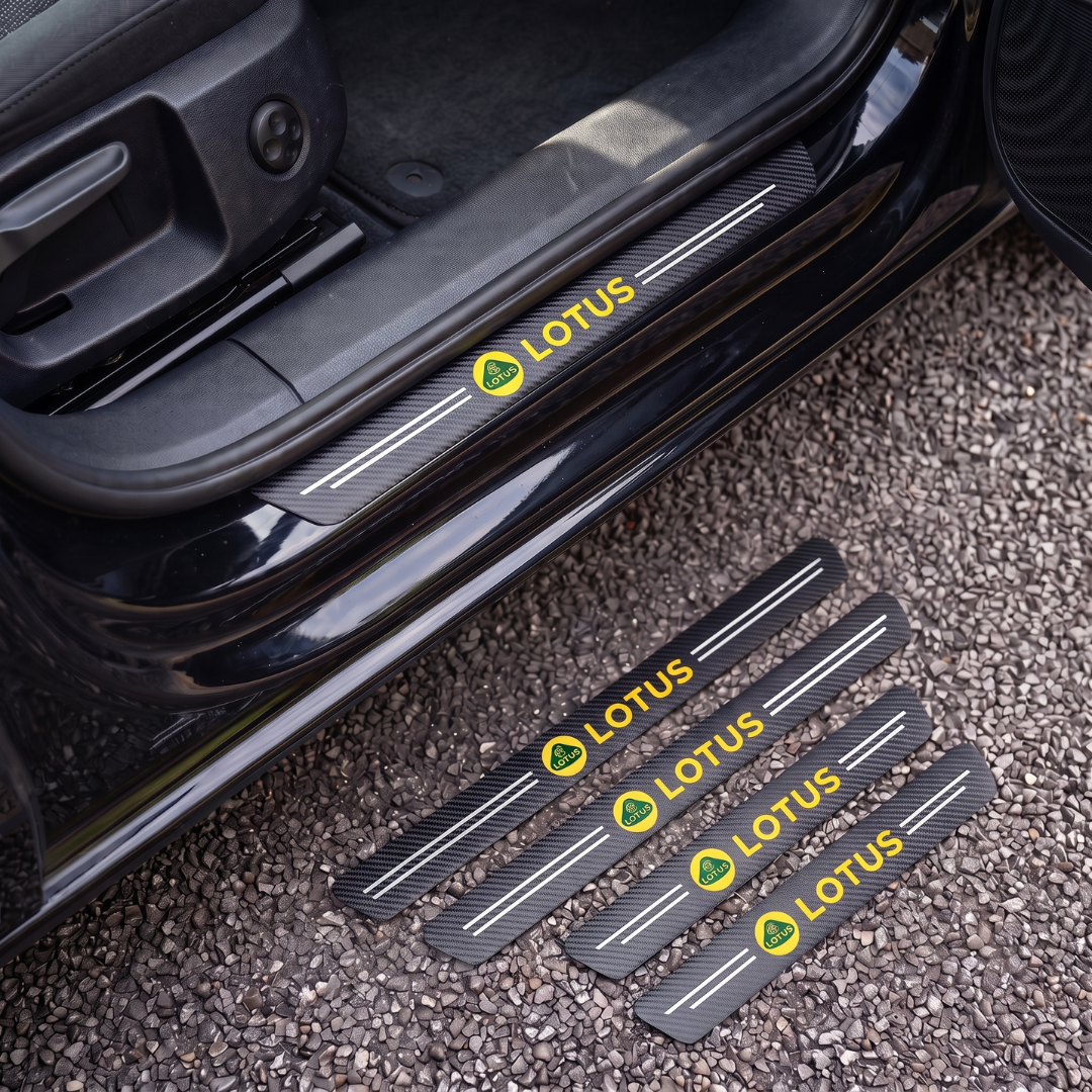 CarbonGrip PRO door sill protectors with Lotus logo: one fitted on the sill, set of 4 on the ground