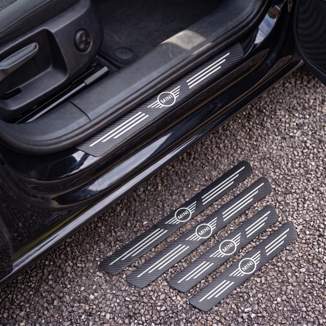 CarbonGrip PRO door sill protectors with Mini logo: one fitted on the sill, set of 4 on the ground