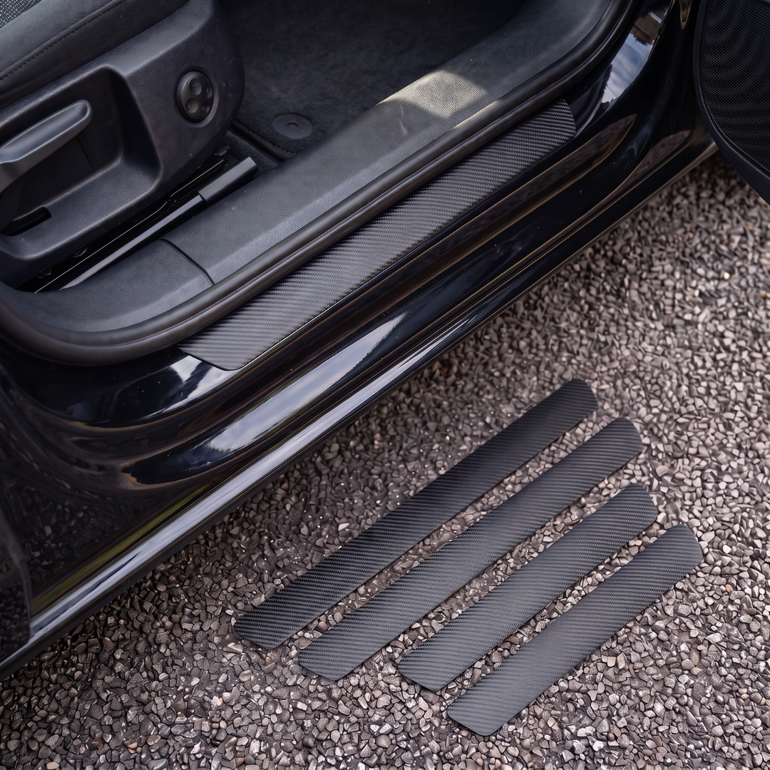 CarbonGrip PRO plain door sill protectors with no logo: one fitted on the sill, set of 4 on the ground