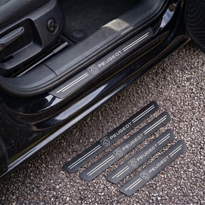 CarbonGrip PRO door sill protectors with new Peugeot logo: one fitted on the sill, set of 4 on the ground