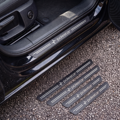 CarbonGrip PRO door sill protectors with Polestar logo: one fitted on the sill, set of 4 on the ground