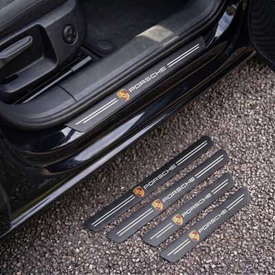 CarbonGrip PRO door sill protectors with Porsche logo: one fitted on the sill, set of 4 on the ground