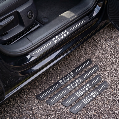 CarbonGrip PRO door sill protectors with Range Rover logo: one fitted on the sill, set of 4 on the ground