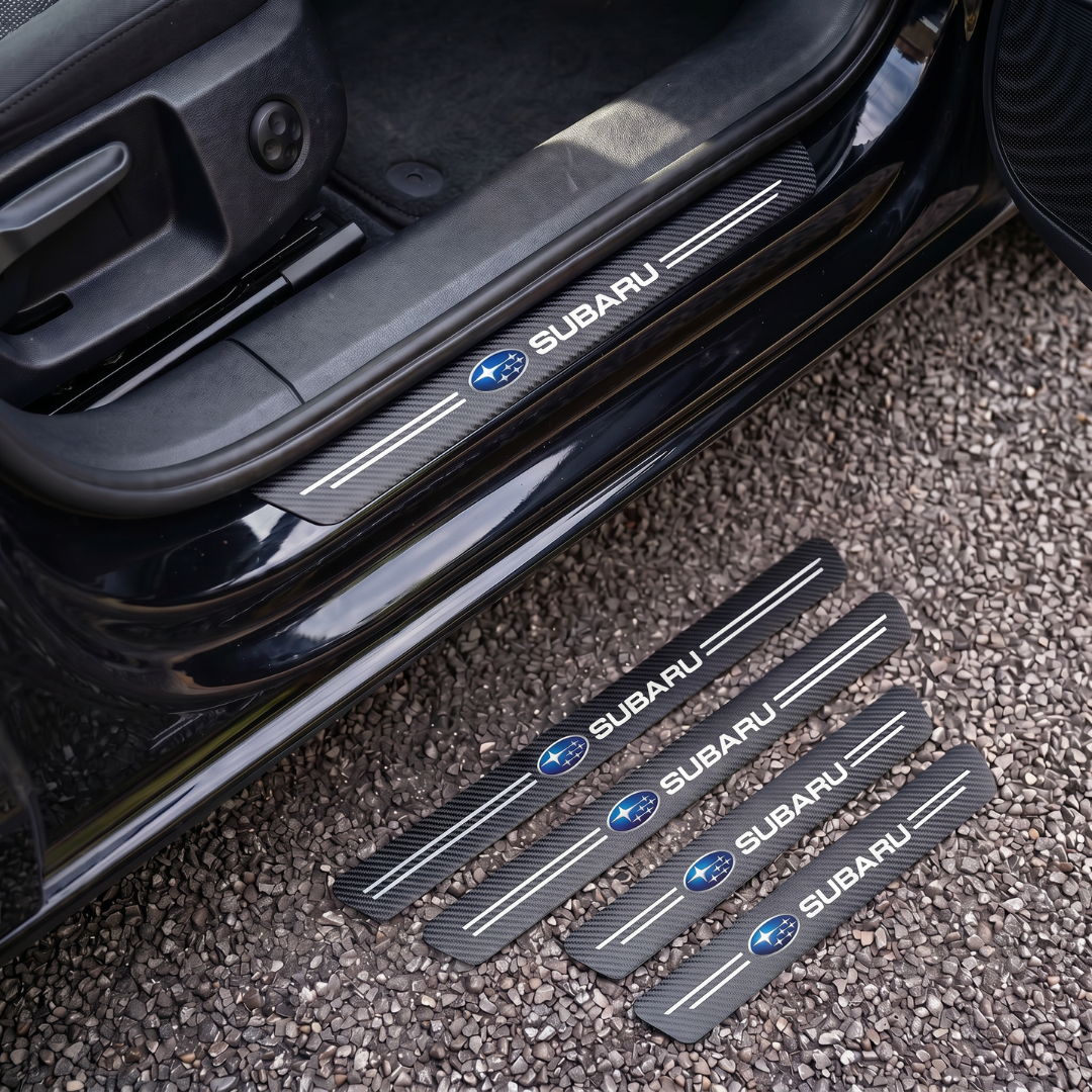 CarbonGrip PRO door sill protectors with Subaru logo: one fitted on the sill, set of 4 on the ground