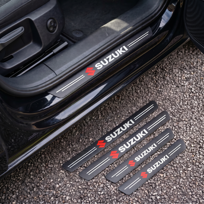 CarbonGrip PRO door sill protectors with Suzuki logo: one fitted on the sill, set of 4 on the ground
