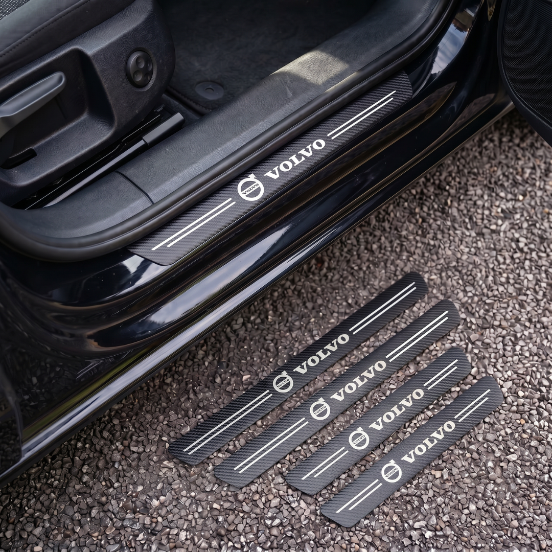 CarbonGrip PRO door sill protectors with Volvo logo: one fitted on the sill, set of 4 on the ground